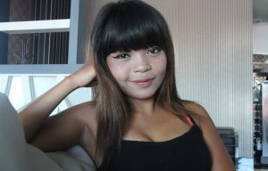 Smooth talking Asian girl poses pretty