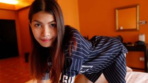 Asian Girl Next Door poses in jersey shirt
