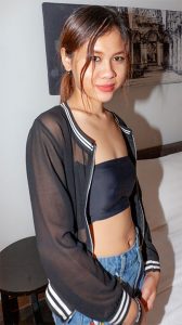 Tuktuk Patrol Blue posing in jean shorts and tube top