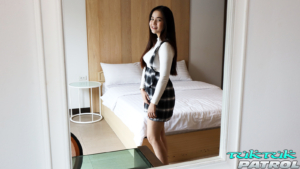 Beautiful Thai teen in plaid outfit