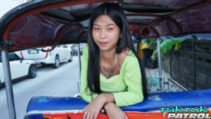 Super cute Thai girl in back of a tuk tuk