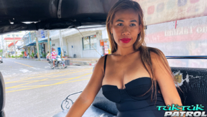 Busty Asian girl models her sexy in tuk