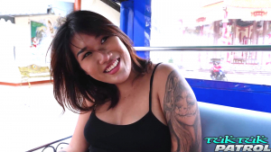 Chubby Asian model happy to be riding tuktuk to the hotel