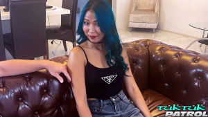 Pretty Thai girl shows her slender body when fully dressed