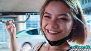Cute Asian teen feeling frisky riding in Tuk