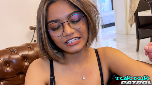 Adorable bespeckled Asian gets cozy on set of tuktuk patrol