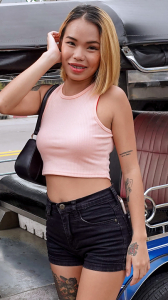 Sultry Thai girl TukTuk Patrol Jaja Star stands near Tuk
