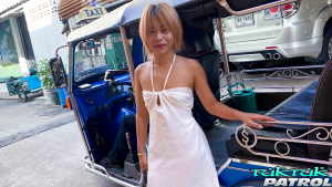 Sexy Asian girl with small titties poses by tuktuk