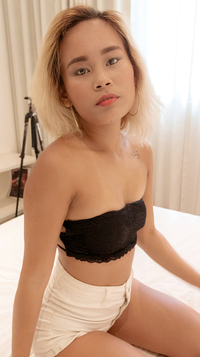 Blonde Indonesian Tuktuk Patrol Mia sits pretty in jean shorts