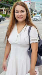 Sexy thick body TukTuk Patrol June poses on a street corner