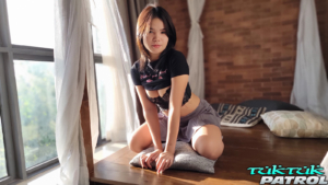 Asian babe seduces two studs with seductive striptease