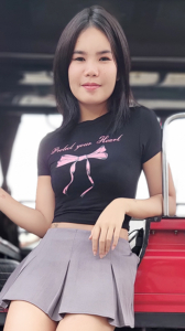 Petite TukTuk Patrol Emmy poses by Tuk in short skirt