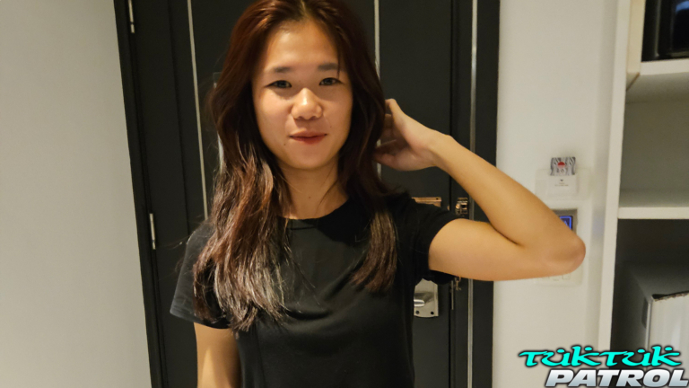Smiling pretty at camera in hotel room