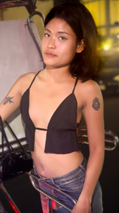 TukTuk Patrol Kham wearing skimpy top showing tattoos
