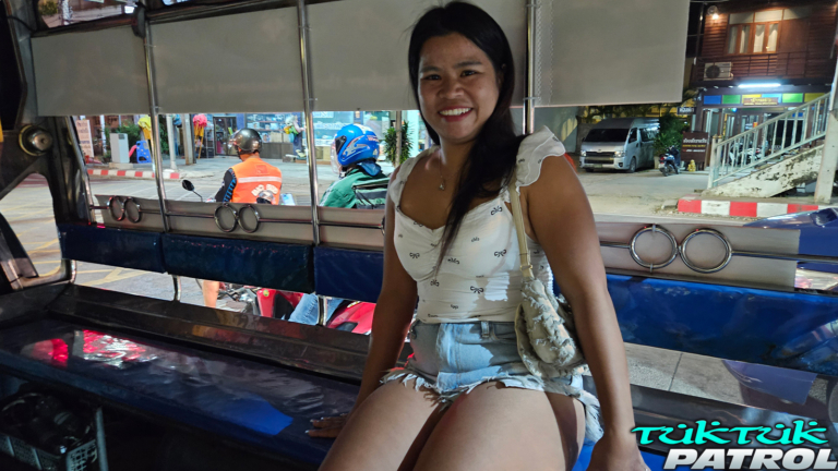 Sitting in back of a tuk tuk