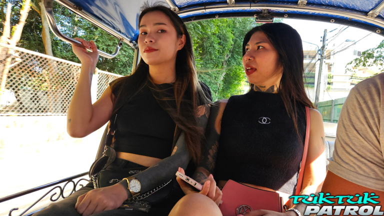Two Thais in back of a tuk tuk