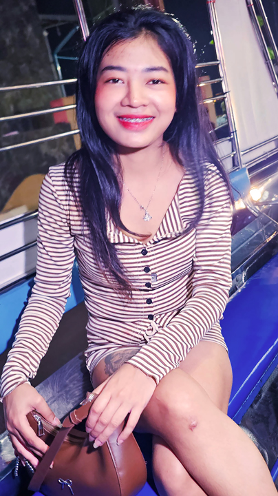 Nam B smiling showing braces while riding tuk