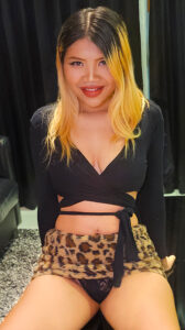 Elsa lifts leopard skin skirt, showing black panties